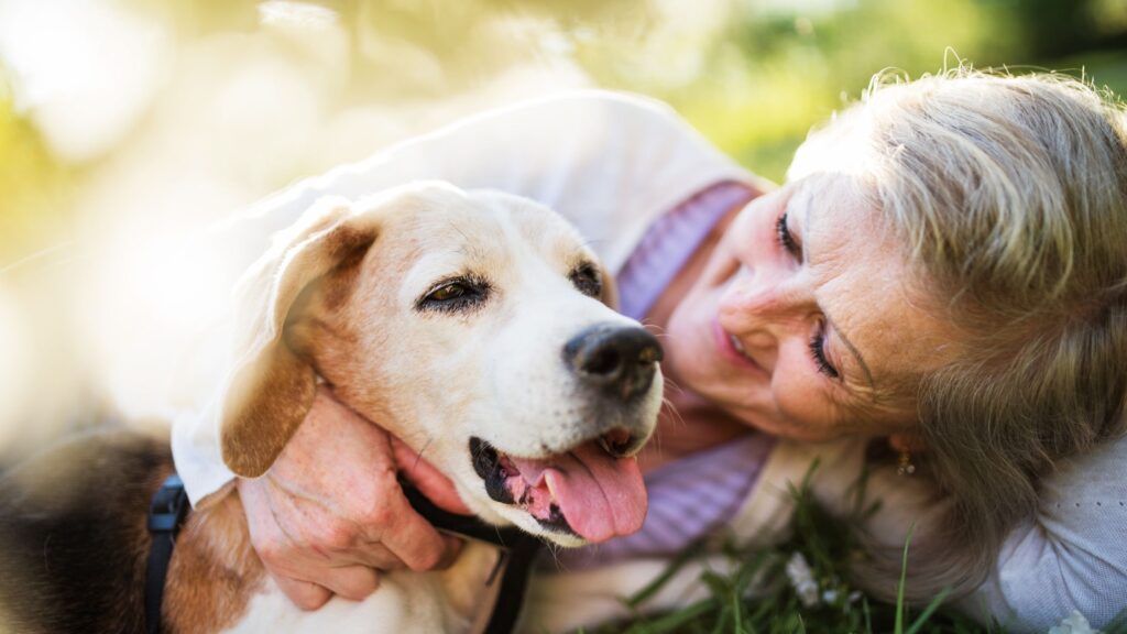 elderly woman at home with her beloved dog.